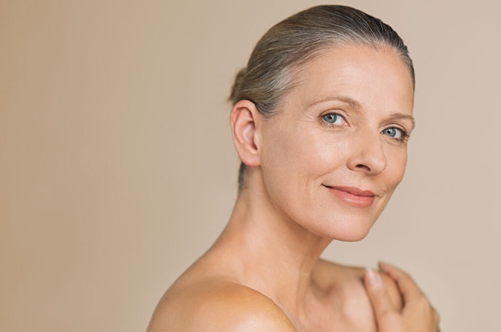 Close-up of aging skin showing fine lines and collagen loss caused by UV damage and lifestyle factors